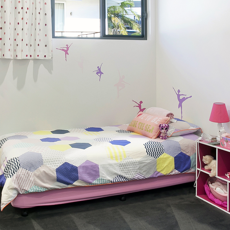 Child's bedroom with ballerinas on the wall