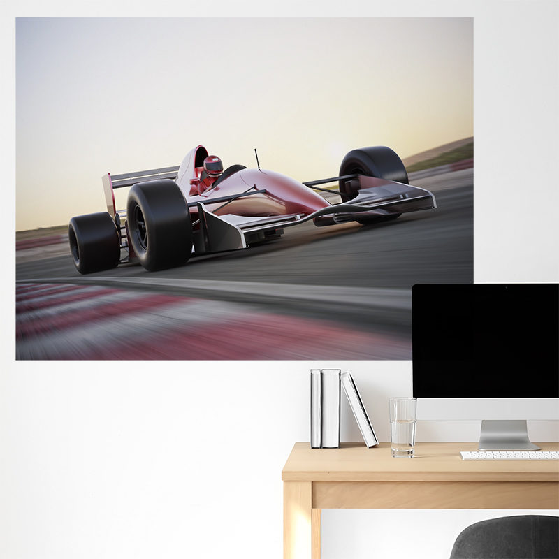 Formula 1 poster above a desk