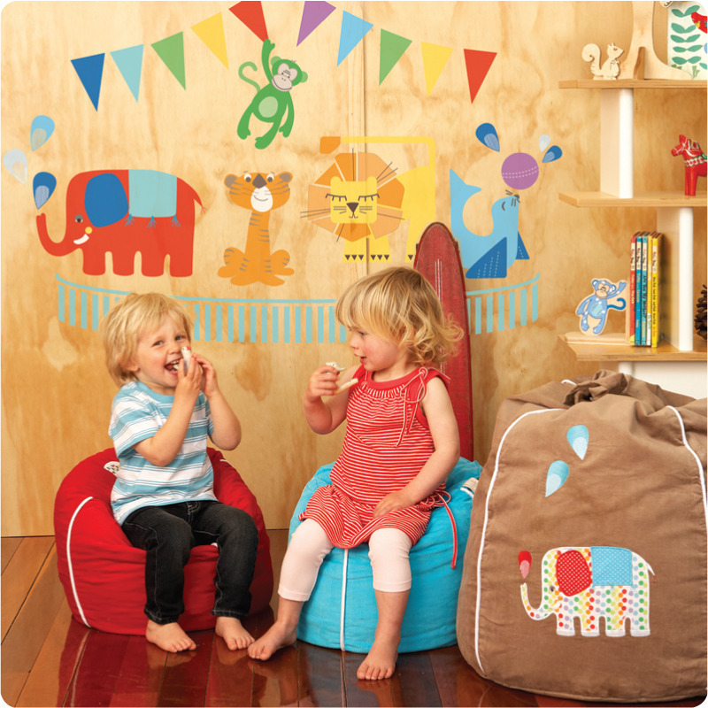 Circus removable wall stickers Cocoon Couture with 2 cute little kids in front sitting on a bean bag