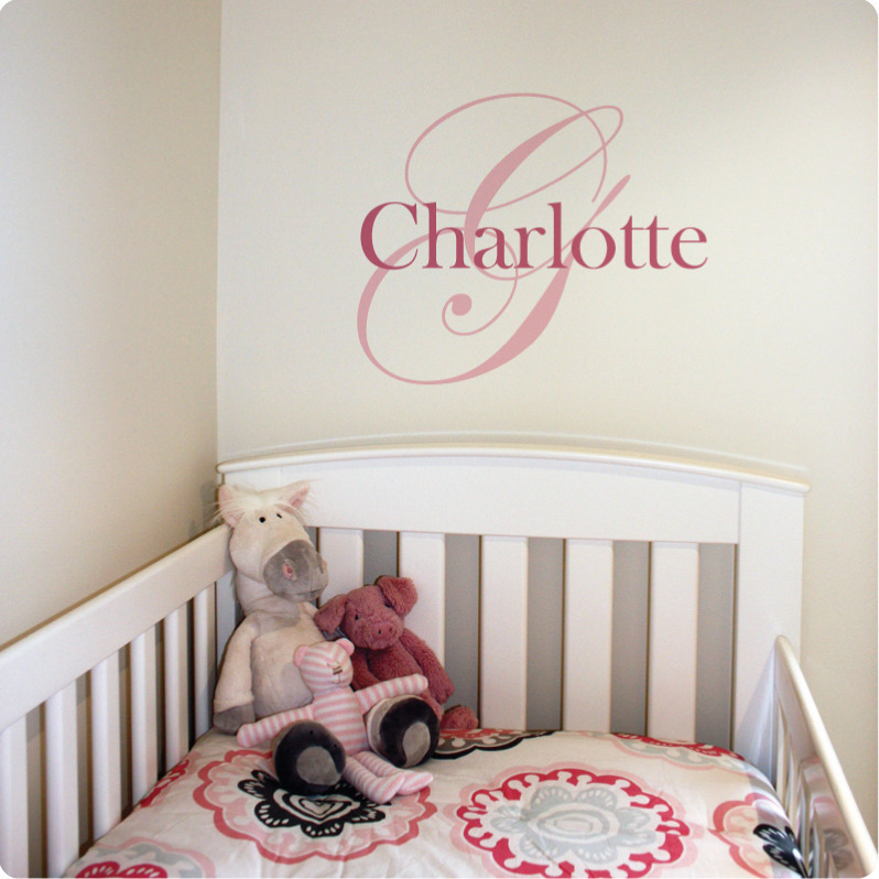 Monogram Removable Wall Stickers with child name Charlotte behind a white crib