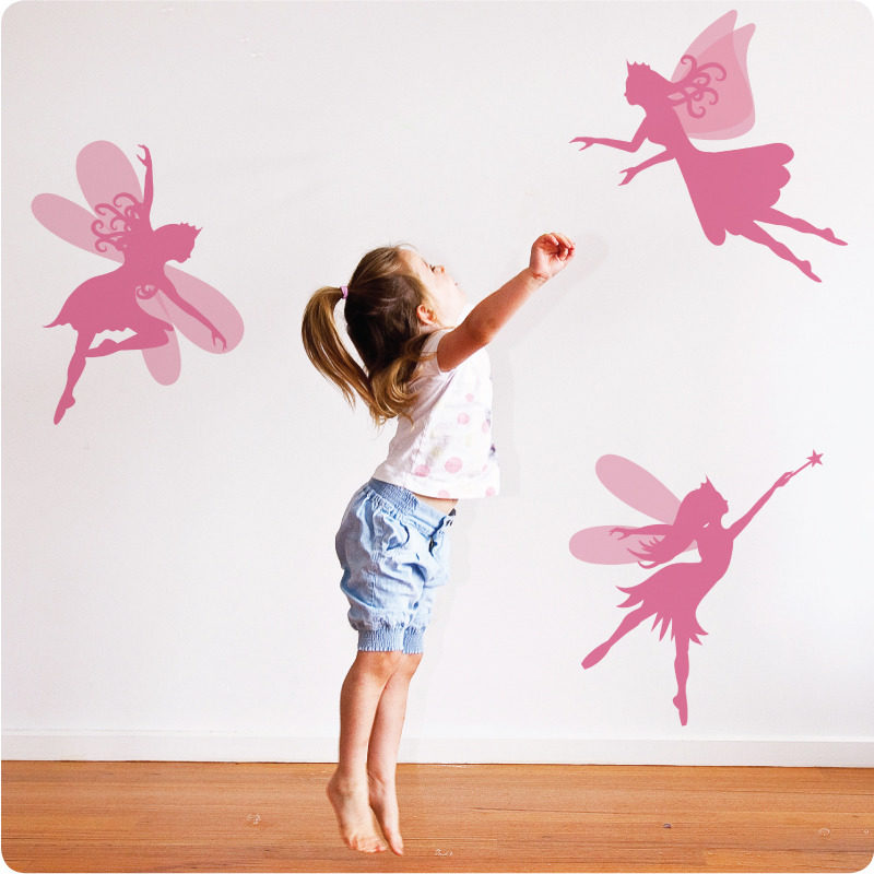 Pretty Fairies Removable Wall Stickers with a little girl in front trying to imitate them