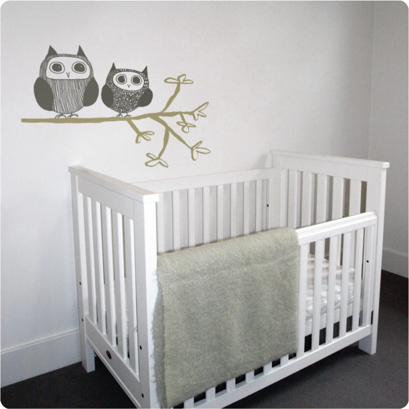 Owl Couple Removable Wall Stickers behind a white crib