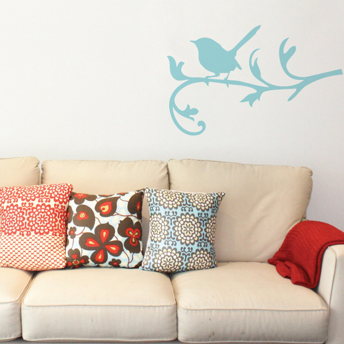 Blue wren removable wall sticker behind a sofa