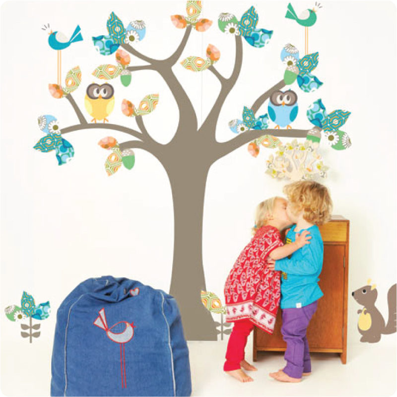 Enchanted Tree removable wall stickers by Cocoon Couture with 2 kids kissing in front