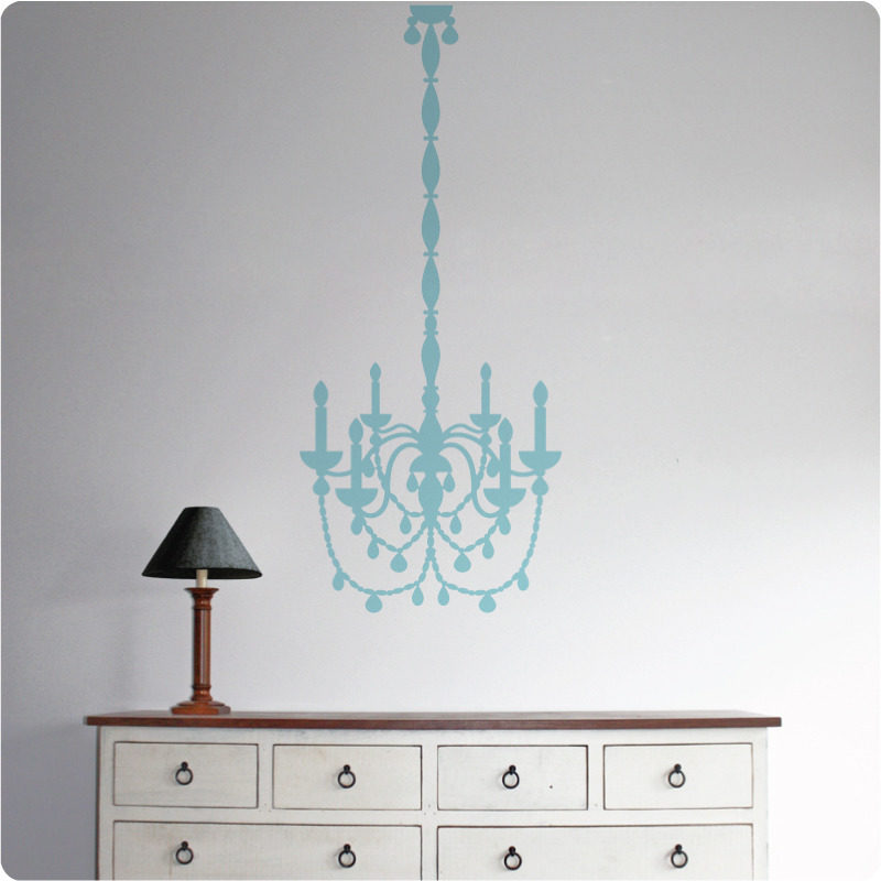 Chandelier removable wall sticker behind a lamp shade on top of a cabinet