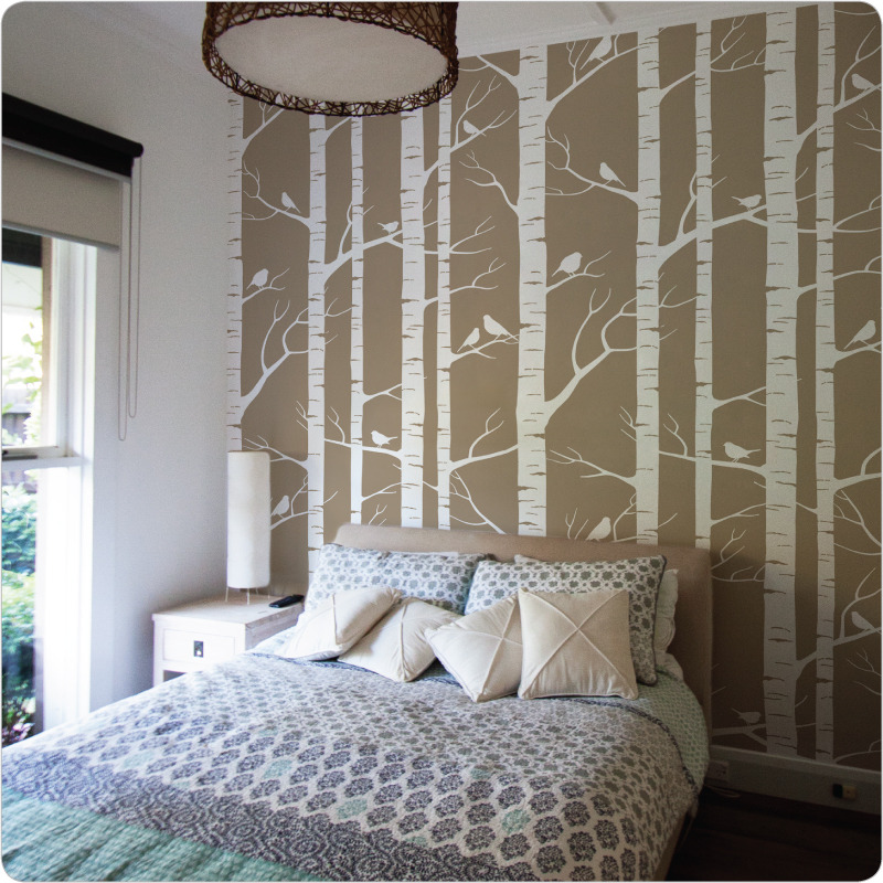 Birch wallpaper Australia by Ink and Spindle behind a bed and side table