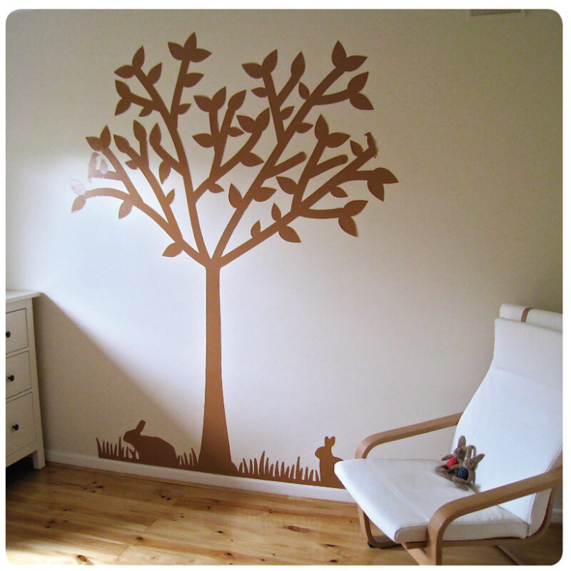 Tree silhouette removable wall sticker behind a chair