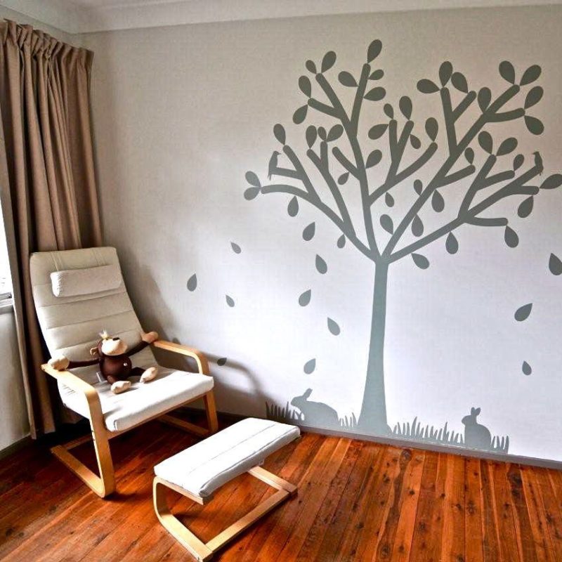 Tree silhouette removable wall sticker behind a lounge chair