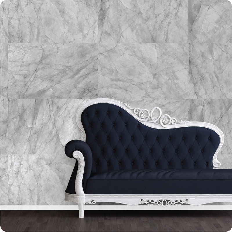 Marble removable wallpaper behind a navy chaise