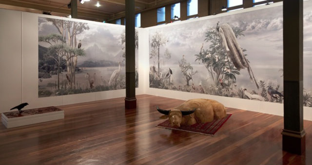 An art exhibition with feature wallpaper