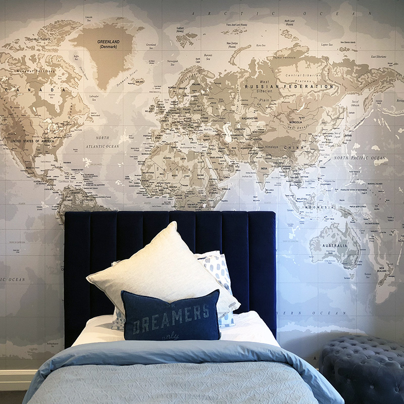 Map Maker wall decal behind a bed