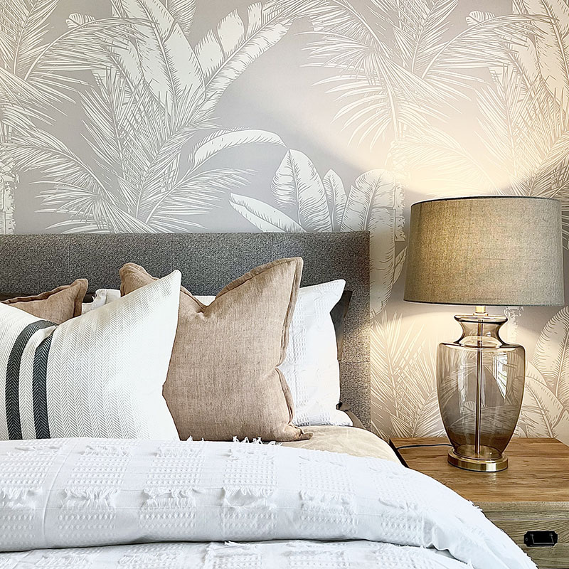 Palm wallpaper in a neutral bedroom