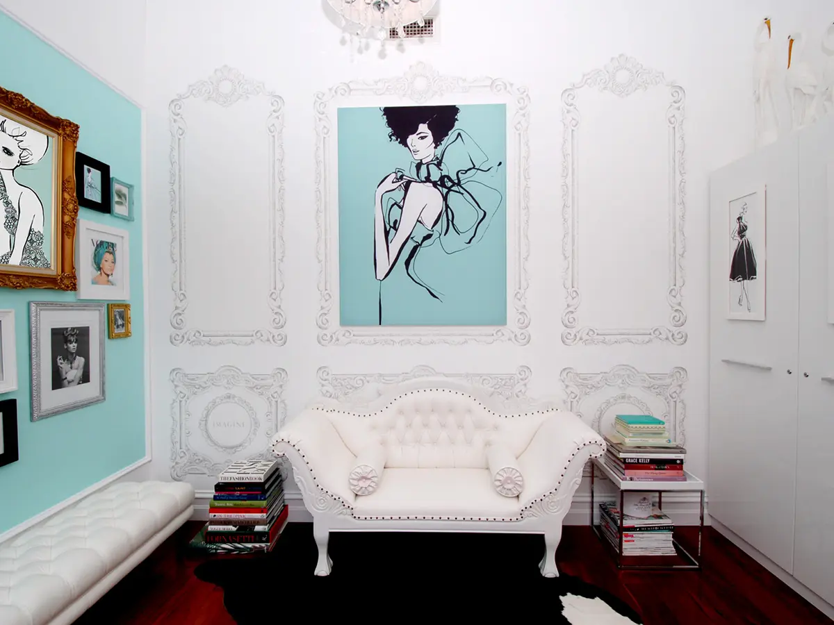 International fashion illustrator Megan Hess in her studio with custom wall decals designed and produced by The Wall Sticker Company.